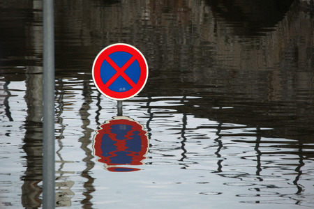 USTI NAD LABEM, CZECH REPUBLIC - JUNE 5, 2013: No stopping, a traffic sign flooded by the swollen Elbe River in Usti nad Labem, Northern Bohemia, Czech Republic, on June 5, 2013.のeditorial素材