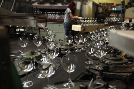 SVETLA NAD SAZAVOU, CZECH REPUBLIC - NOVEMBER 7, 2014: Automatic production of machine blown stemware at the Bohemian glass factory Crystalite Bohemia in Svetla nad Sazavou, Czech Republic.のeditorial素材