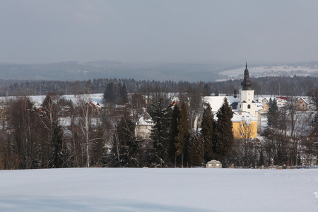 Winter landscape with the village of Jindrichovice in the background in Western Bohemia, Czech Republic.の写真素材