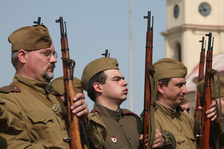 ORECHOV, CZECH REPUBLIC - APRIL 27, 2013: Re-enactors dressed as Soviet soldiers attend the re-enactment of the Battle at Orechov (1945) near Brno, Czech Republic. The Battle at Orechov in April 1945 was the biggest tank battle in the last days of the Worのeditorial素材