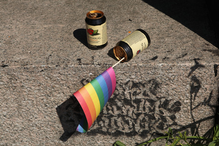 PRAGUE, CZECH REPUBLIC - AUGUST 17, 2013: Rainbow flag inserted in the empty beverage can after the Rekorderlig Cider seen during the Prague Gay Pride Festival in Prague, Czech Republic.のeditorial素材