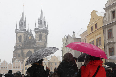 PRAGUE, CZECH REPUBLIC - FEBRUARY 23, 2013: Heavy snowfall covering the Tyn Church on Old Town Square in Prague, Czech Republic.のeditorial素材