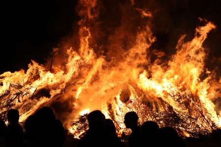 BURG, GERMANY - APRIL 23, 2011: People look at the traditional Easter bonfire in the Lusatian village of Burg in Spreewald Region, Lower Lusatia, Brandenburg, Germany.のeditorial素材