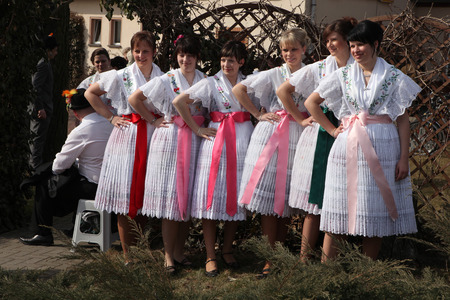 TURNOW, GERMANY - MARCH 13, 2011: Young women in Sorbian costumes attend the Zapust Carnival in the Lusatian village of Turnow near Cottbus, Lower Lusatia, Brandenburg, Germany.のeditorial素材