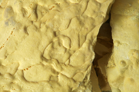 Solid sulphur at the sulphur mines in the crater of the active volcano of Kawah Ijen, East Java, Indonesiaの写真素材