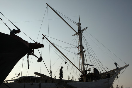JAKARTA, INDONESIA - AUGUST 16, 2011: Wooden sailing ships called pinisi in the historical port of...