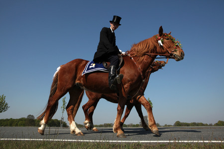 RALBITZ, GERMANY - APRIL 24, 2011: Easter Riders attend the Easter ceremonial equestrian procession in the Lusatian village of Ralbitz near Bautzen, Upper Lusatia, Saxony, Germany.のeditorial素材