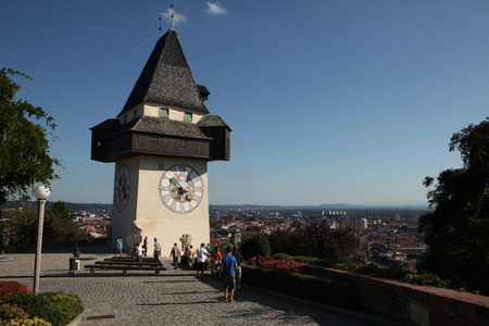 GRAZ, AUSTRIA - SEPTEMBER 3, 2011: People enjoy panoramic views from near the Uhrturm (Clock Tower) on the Grazer Schlossberg (Castle Hill) in Graz, Styria, Austria.のeditorial素材