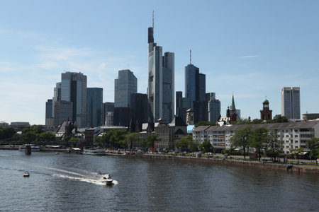 FRANKFURT AM MAIN, GERMANY - JUNE 14, 2015: Modern skyscrapers in the Bankenviertel (banking district) over the Main River in Frankfurt am Main, Hesse, Germany.のeditorial素材