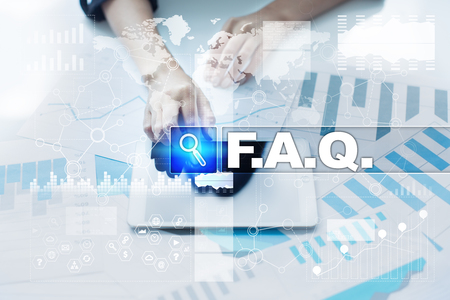 Woman working with documents, tablet pc and selecting f.a.q..の写真素材