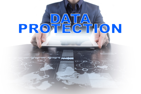 Businessman working with modern tablet PC and presenting data protection concept.の写真素材