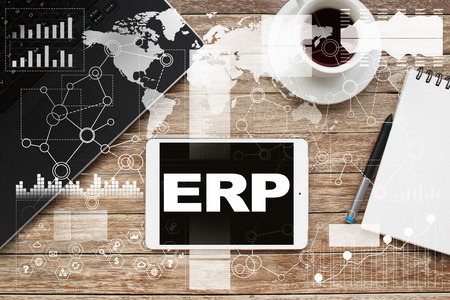 Tablet on desktop with erp text.の写真素材
