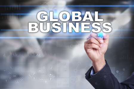 Businessman is drawing on virtual screen. global business concept.の写真素材