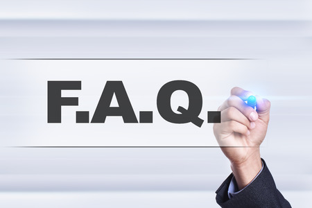 Businessman drawing on virtual screen. f.a.q. concept.の写真素材