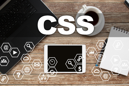 Tablet on desktop with css text.の写真素材