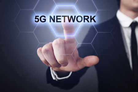 Businessman selecting 5g network on virtual screen.の写真素材