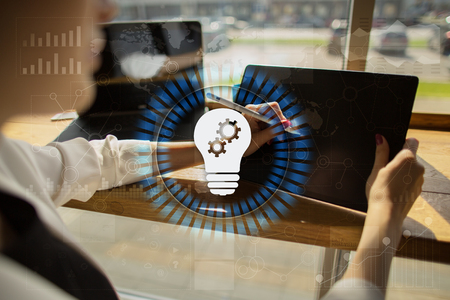 Lamp icon on virtual screen. Business solution. Innovation concept.の写真素材
