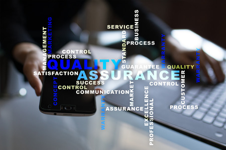 Quality assurance concept on the virtual screen. Business concept. Words cloud.の写真素材