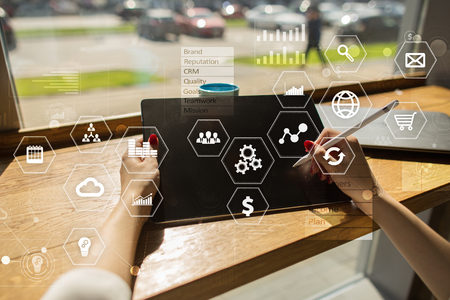 Business and technology concept. Graphs and icons on virtual screen background.の写真素材