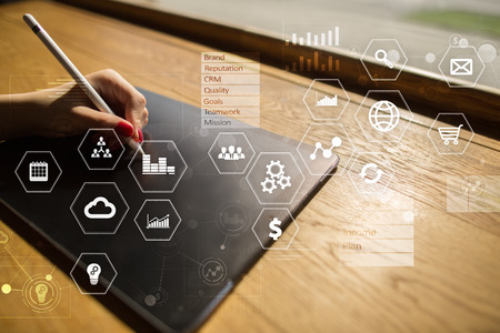 Business and technology concept. Graphs and icons on virtual screen background.の写真素材
