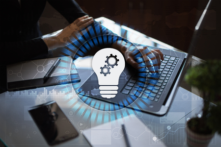 Lamp icon on virtual screen. Business solution. Innovation concept.の写真素材