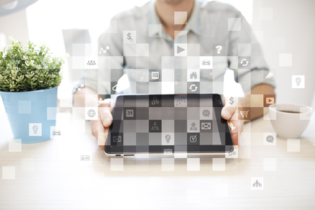 Virtual screen interface with applications icons. APPS. Work Business process in modern office. Strategy planning  Internet technology concept.の写真素材