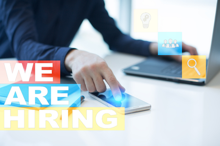 We are hiring text on virtual screen. Recruitment. HR. Human resources management. Business concept.の写真素材