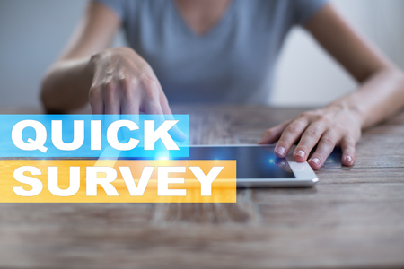 Quick survey text on virtual screen. Feedback and customers testimonials. Business internet and technology concept.の写真素材