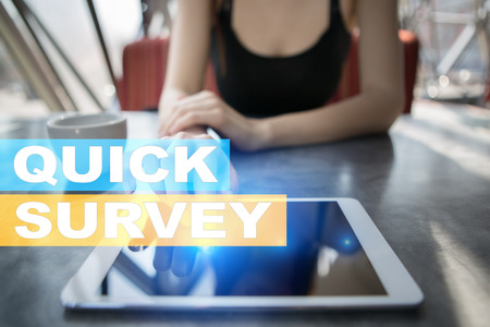 Quick survey text on virtual screen. Feedback and customers testimonials. Business internet and technology concept.の写真素材