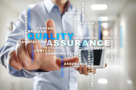 Quality assurance concept on the virtual screen. Business concept. Words cloud.の写真素材