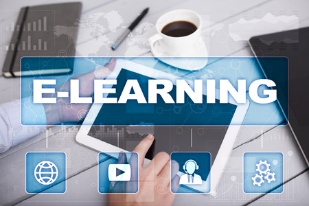 E-Learning on the virtual screen. Internet education concept.