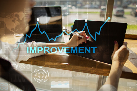 Improvement graph on virtual screen. Business and technology concept.