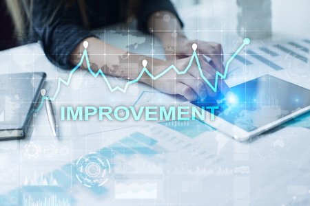Improvement graph on virtual screen. Business and technology concept. の写真素材