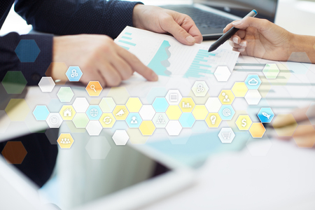 Colored applications icons and graphs on virtual screen. Business, internet and technology concept.の写真素材