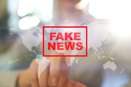 Fake news warning on the virtual screen.の写真素材