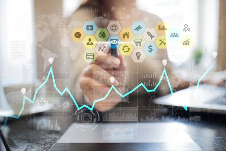 Colored applications icons and graphs on virtual screen. Business, internet and technology concept.の写真素材
