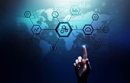 Automation and smart industry 4.0, Internet of things (IOT), Gears and system structure on virtual screen. Business and technology concept.の写真素材