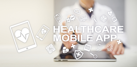 Healthcare mobile apps. Modern medical technology on virtual screen.の写真素材