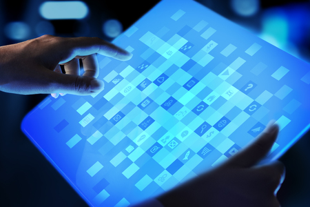 Application icons on virtual screen. Technology and business concept.
