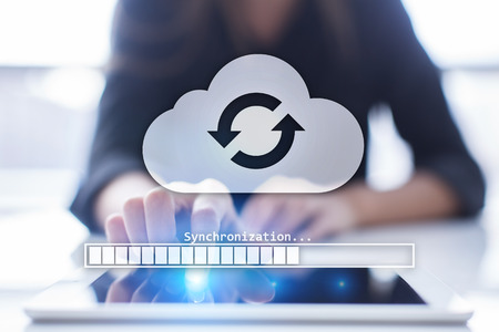 Cloud synchronization, Data storage, internet and computing concept on virtual screen.の写真素材