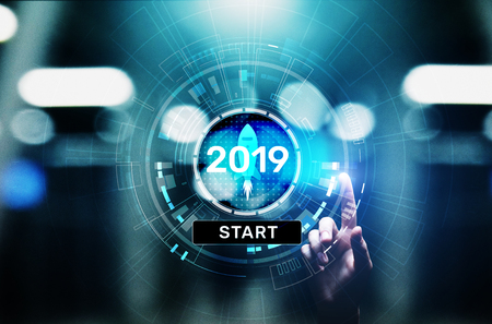New year 2019 start button on virtual screen hologram. FInancial growth and new perspective in...