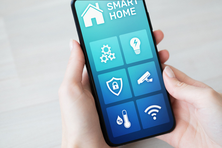 Smart home control application on mobile phone screen. Automation and iot conceptの写真素材