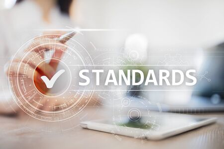Standards, Quality Control, Assurance, ISO, Checkbox on virtual screen.の写真素材
