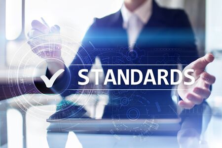 Standards, Quality Control, Assurance, ISO, Checkbox on virtual screen.の写真素材