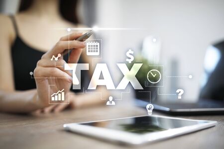 Concept of TAX paid by individuals and corporations. VAT. Income and wealth tax.の写真素材