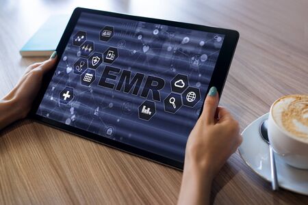 Electronic medical Health record information system on device screen. Modern technology in medicine as concept.の写真素材