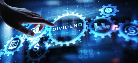 Dividends button on virtual screen. Return on Investment ROI financial business wealth concept.の写真素材