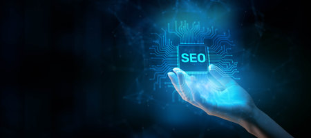 SEO Search Engine Optimization Concept: Enhancing Online Visibility Illustrated on a Processor Touched by a Human Hand.の写真素材