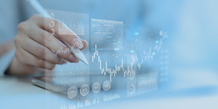 Stock Market Data Visualization and Financial Trading Analytics Dashboard on Touchscreen Tablet.