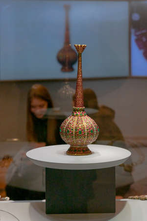 rose water sprinkler by Cartier, embellished with large emeralds and rubies, luxury item from treasury of the Mughal Emperors. North India Mughal period, 17th century, at the exhibitionのeditorial素材